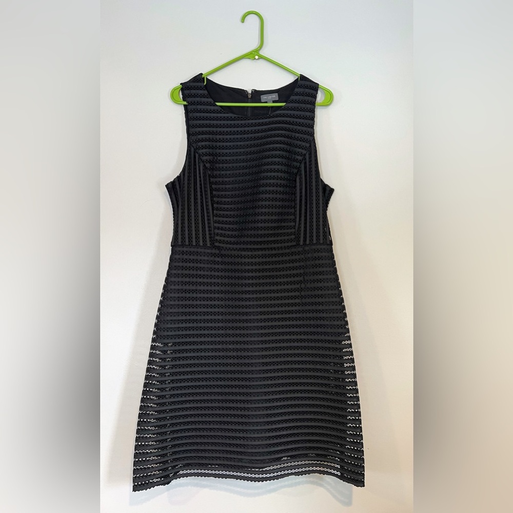 Black, a-line dress with sheath underneath & fun see through net overlay.